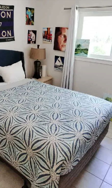 The same bed made up with a patterned bedspread